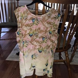 Cabi blouse.  Beautiful with a slit in the back.